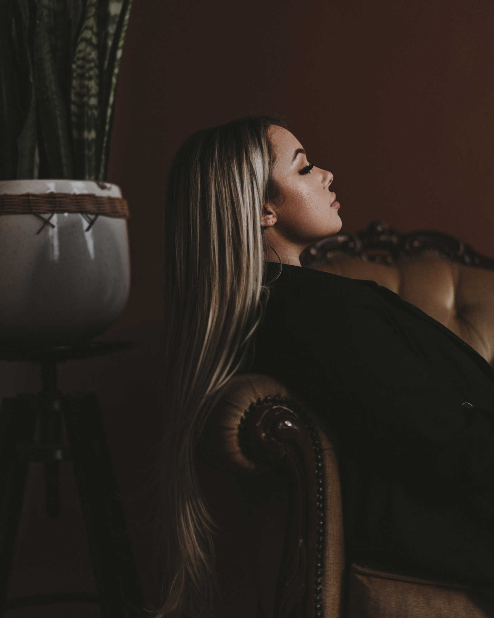 Woman with Long Hair Lying on a Sofa